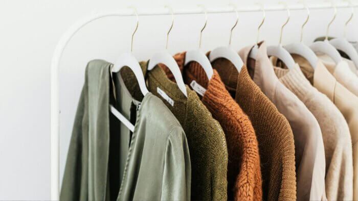 Plant wool sweaters on a rack