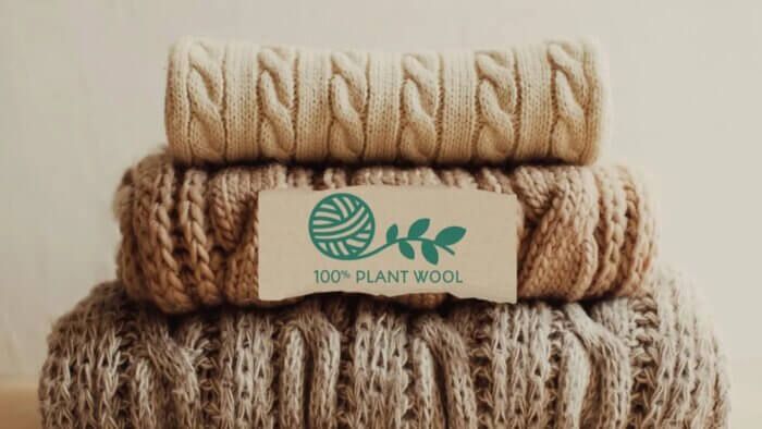 Three garments made from plant wool piled on top of each other