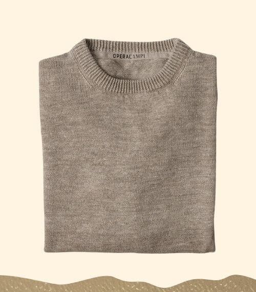 An Opera Campi hemp sweater in front of a beige background