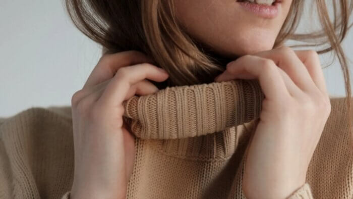 A woman in a plant wool jumper