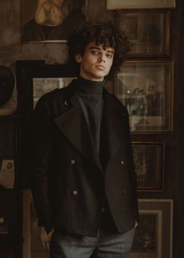 A model wearing a vegan suit jacket from de Ionescu